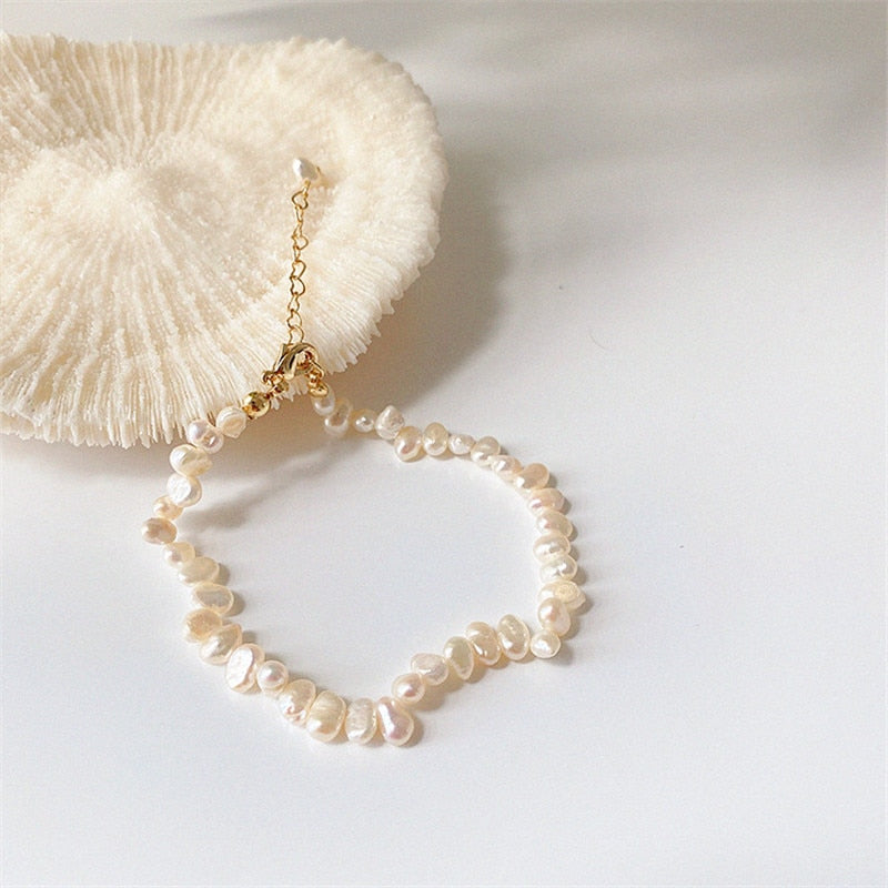 These vintage style natural freshwater pearl necklaces and bracelets are always a sweet fashion option. They have a retro beach feel and compliment all skin tones. The necklace sits at the clavicle. Treat yourself of send someone a lovely, kind gift.