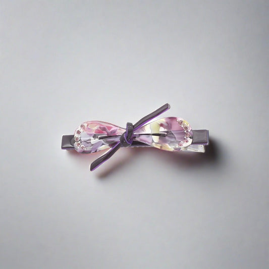 Bow shaped hair clip for women and girls available in a range of pretty and subtle, stylish colours.  Each clasp secures easily to all hair types - short and long, fine and thick.  These clips can also be used on clothing, shoes and bags to add a point of distinction and a fashionable emphasis.   Made from quality acrylic acetate which is an eco-friendly recyclable plastic material.