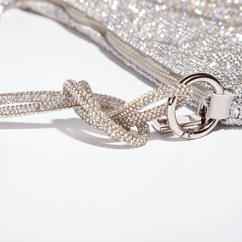 Soft style classic 70s style rhinestone glow mesh style clutch handbag. Knotted handles add a point of difference to the purse.   Think crystal, diamond, luxury fashion.  Perfect for dinner parties, weddings, evening functions. 