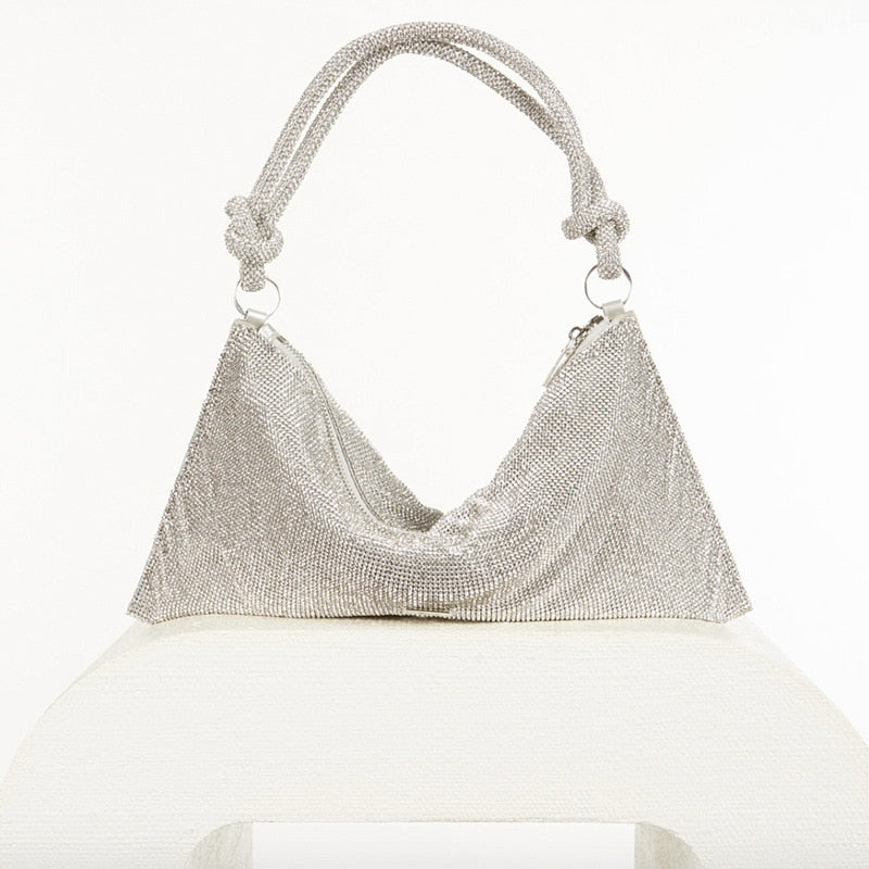 Soft style classic 70s style rhinestone glow mesh style clutch handbag. Knotted handles add a point of difference to the purse.   Think crystal, diamond, luxury fashion.  Perfect for dinner parties, weddings, evening functions. 