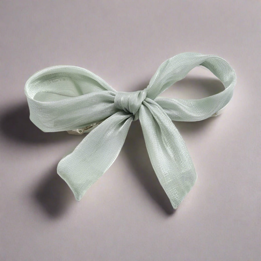 Double layered tulle bows on solid hair grips in soft hues to compliment most outfits, hair colours and styles. Clip these barrettes onto a pony tail, secure a side sweep or accent a half up half down do. Subtle, sweet, sophisticated but also kind of irresistibly cute bow barrettes.  stocking fillers