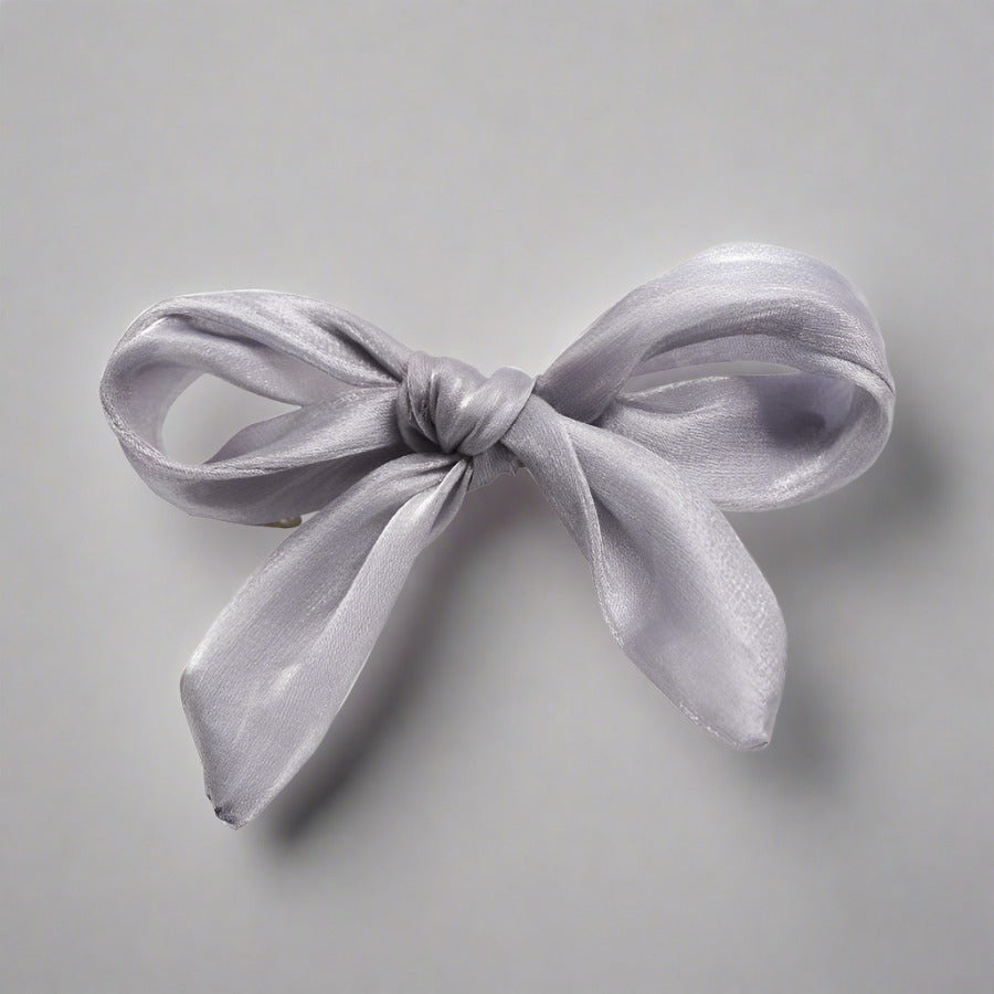 Double layered tulle bows on solid hair grips in soft hues to compliment most outfits, hair colours and styles. Clip these barrettes onto a pony tail, secure a side sweep or accent a half up half down do. Subtle, sweet, sophisticated but also kind of irresistibly cute bow barrettes.  stocking fillers
