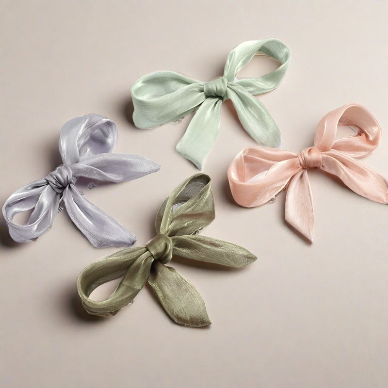 Double layered tulle bows on solid hair grips in soft hues to compliment most outfits, hair colours and styles. Clip these barrettes onto a pony tail, secure a side sweep or accent a half up half down do. Subtle, sweet, sophisticated but also kind of irresistibly cute bow barrettes.  stocking fillers