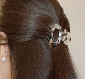 Mini claw clips are the trendiest hair accessory of 2022. These cute claw grips are the best way to get into this trend and match this seasons colours. An essential beauty tool to keep hair away from your face and add easy style to any look.