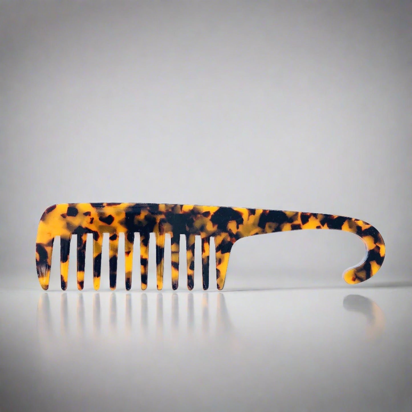 Wide tooth combs for use the bath and shower. These combs help to protect your hair and reduce damage to the strands when removing knots and tangles or working through hair conditioner