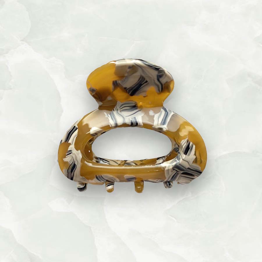 Mini claw clips are the trendiest hair accessory of 2022. These cute claw grips are the best way to get into this trend and match this seasons colours. An essential beauty tool to keep hair away from your face and add easy style to any look.